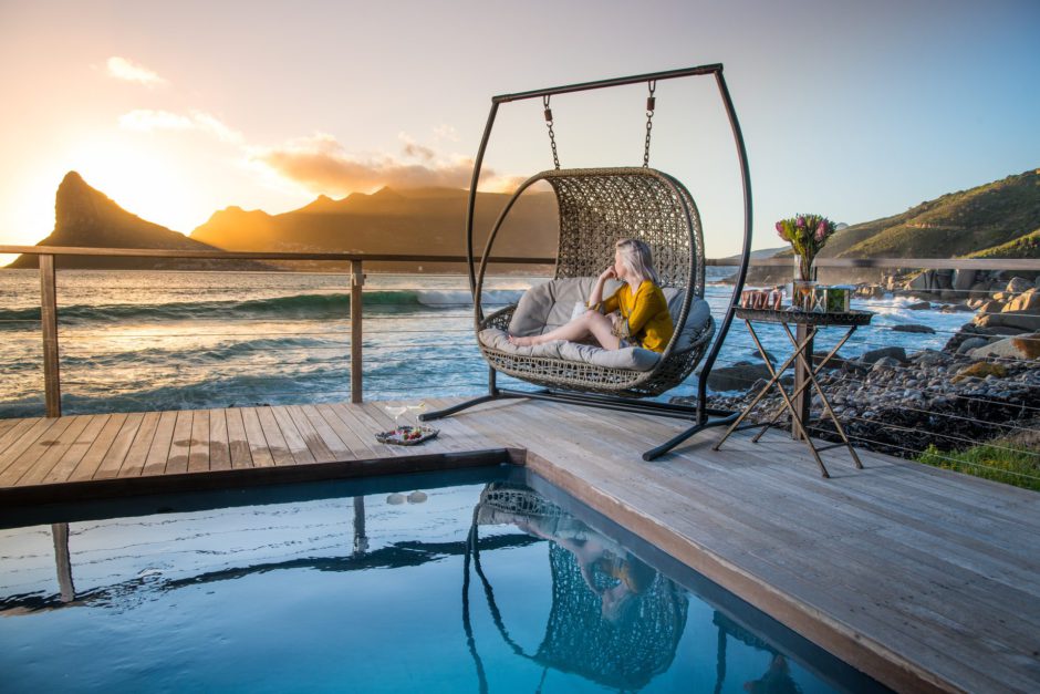 Woman posing from pool petio with Lions Head in the background