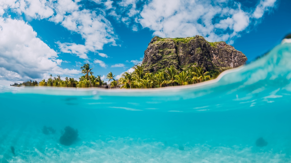 Escape winter and travel to one of the beautiful Indian Ocean islands: Partially submerged ocean photo of island