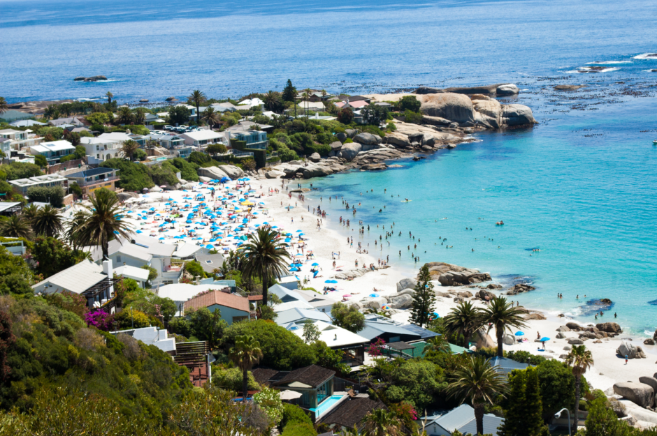 Clifton 4th Beach dotted with umbrellas and beach-goers