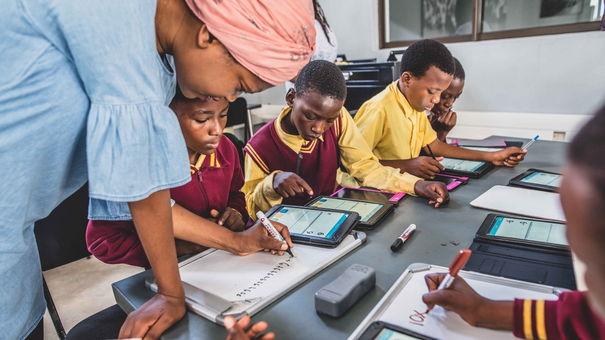 Children being educated through digital learning