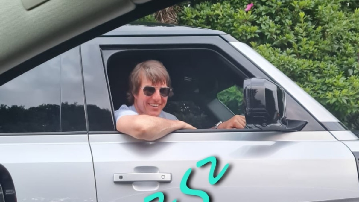 Tom Cruise driving by