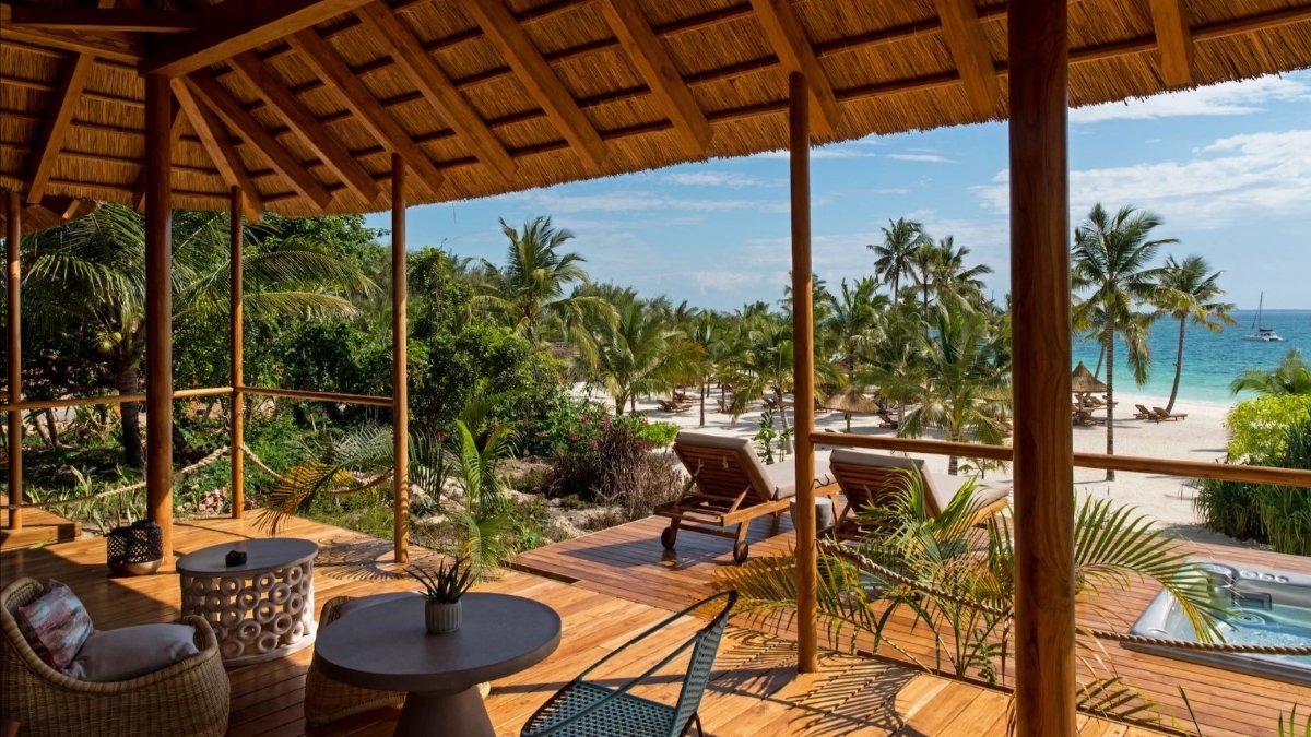 Viewing deck overlooking beach, palm trees and ocean