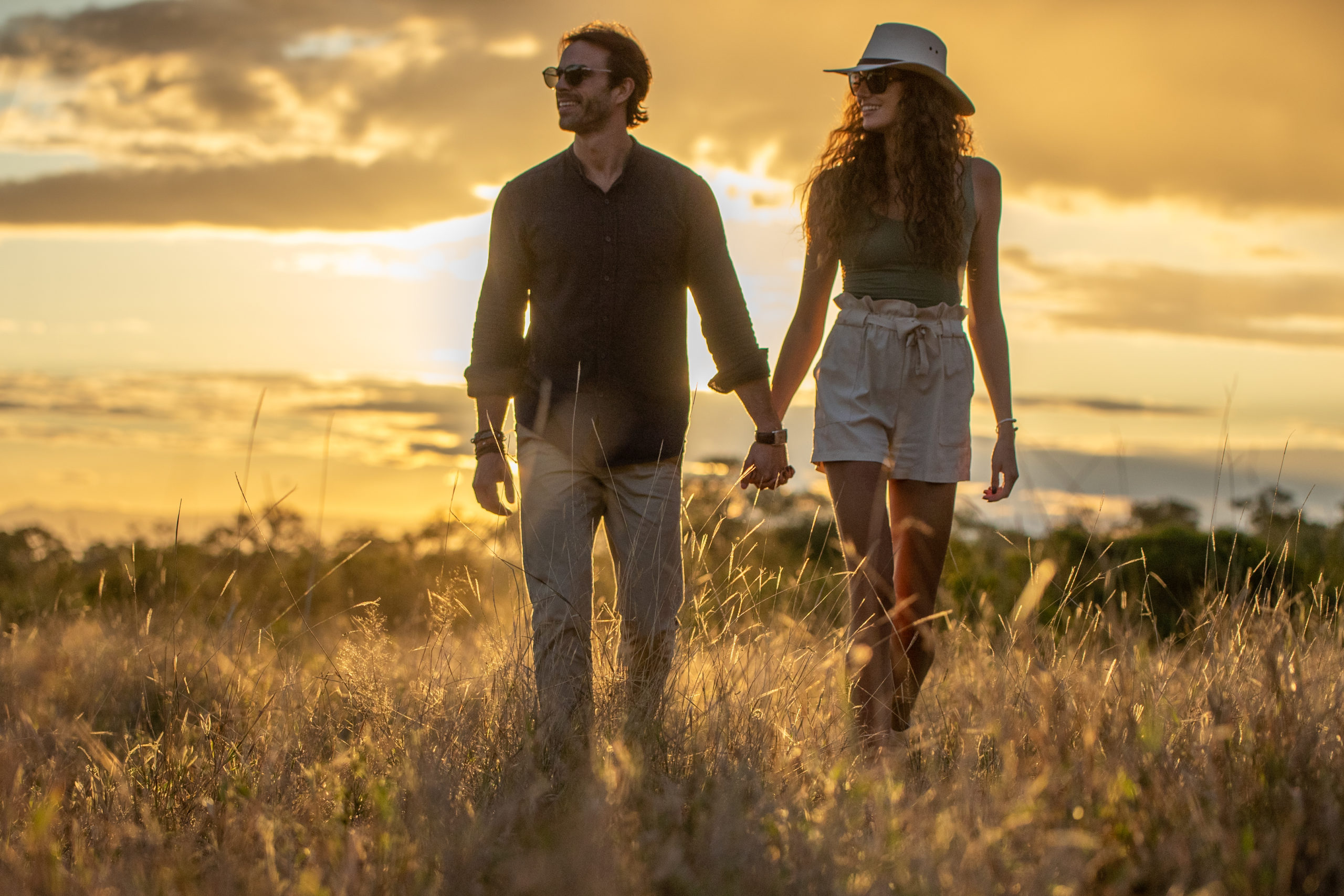 Couple walking hand in hand at Silvan Safari