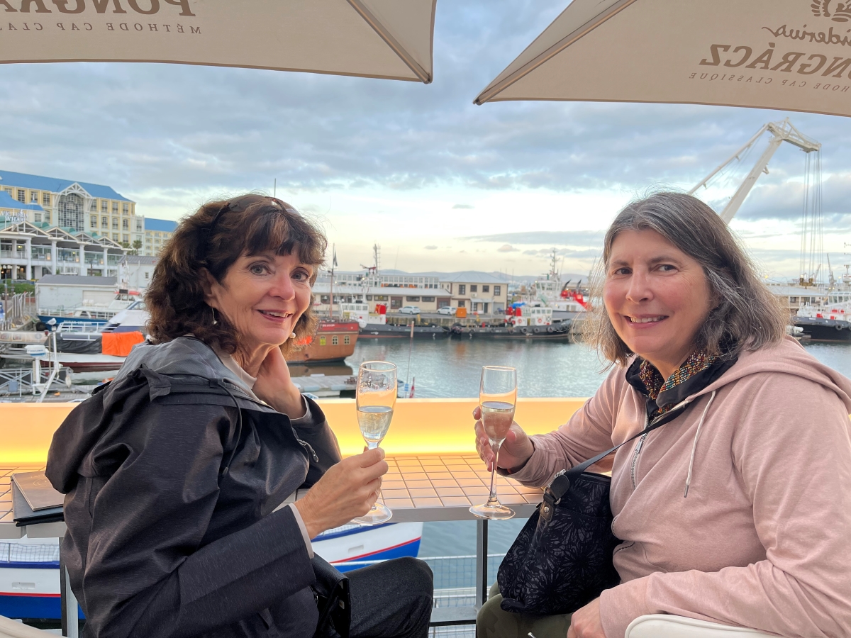 Lindy and her cousin enjoying bubbly at one of her favorite Cape Town spots, the V&A Waterfront