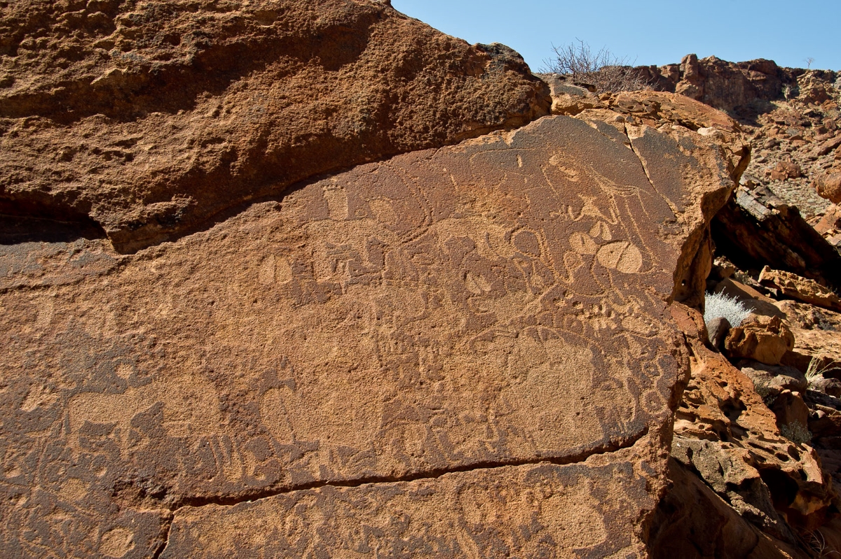 Rock full of elaborate bushman engravings in Namibia