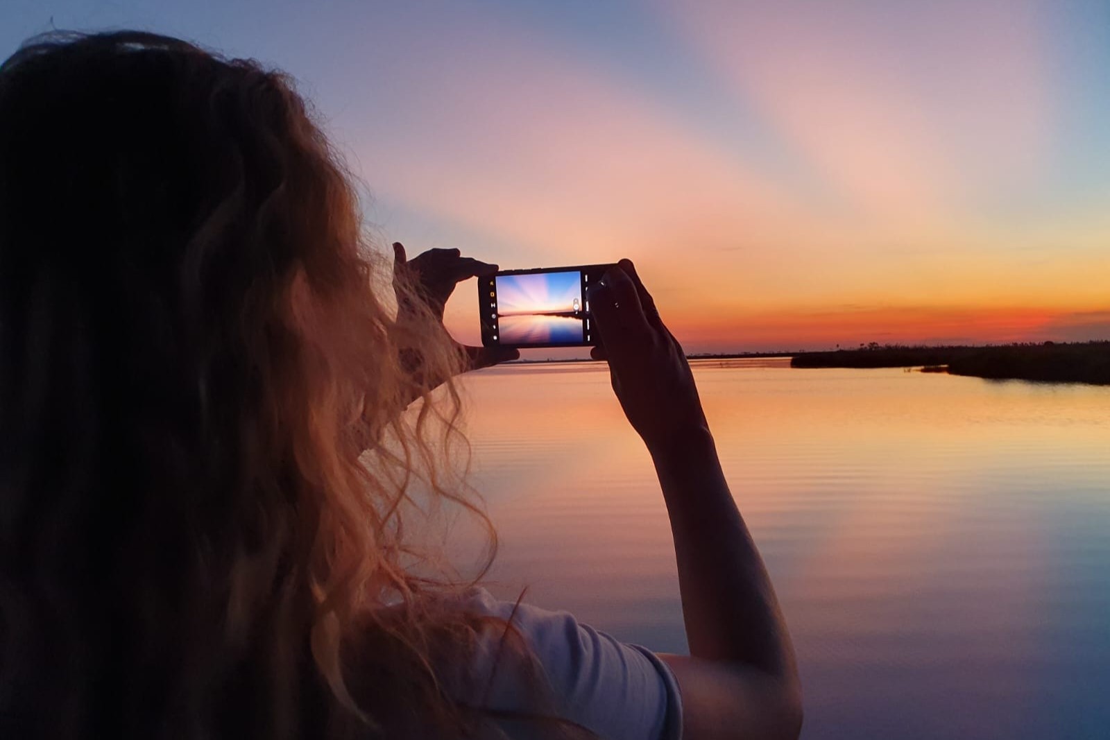 Bianca taking a photo of the sunset