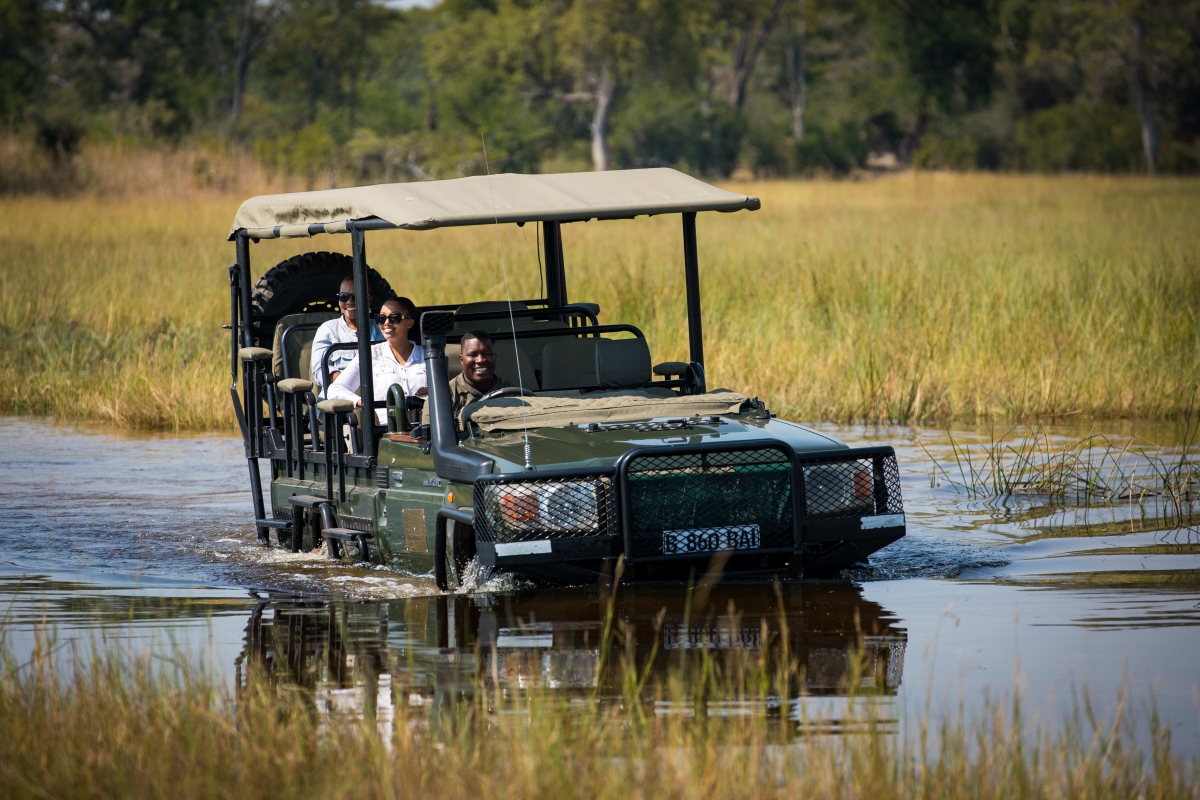 Game drive vehicle taking guests through the waterways