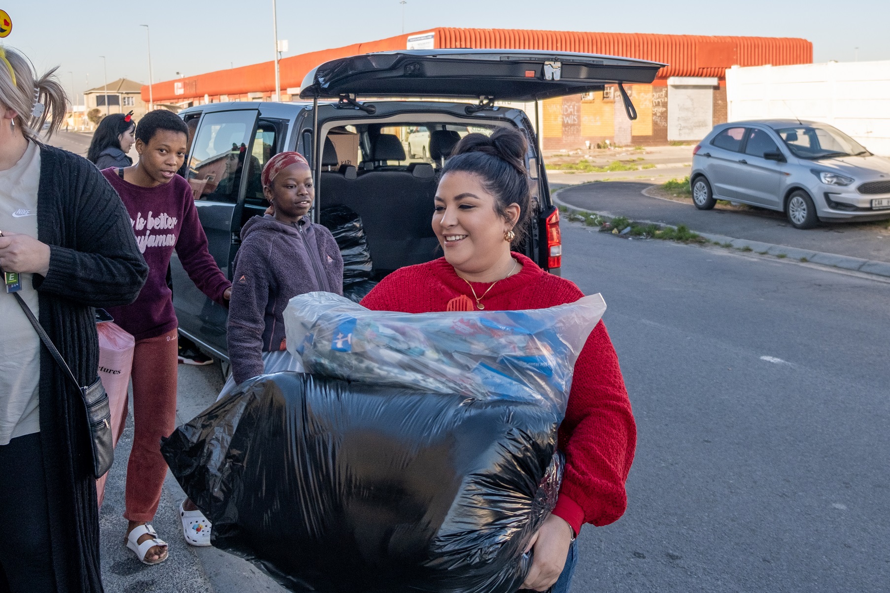 Rhino Crash delivering winter blankets and hot water bottles