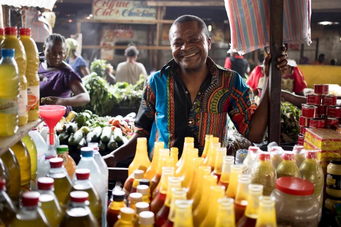 Vendor selling fruit juice at a market in Brazzaville