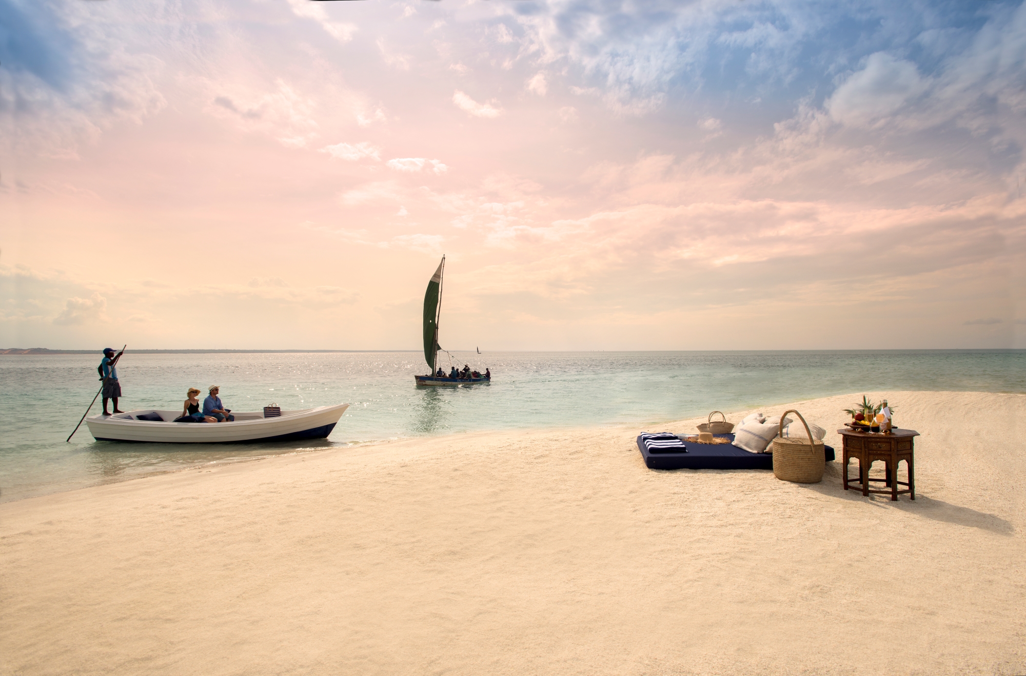 Guests arriving by boat for an awaiting private beach picnic