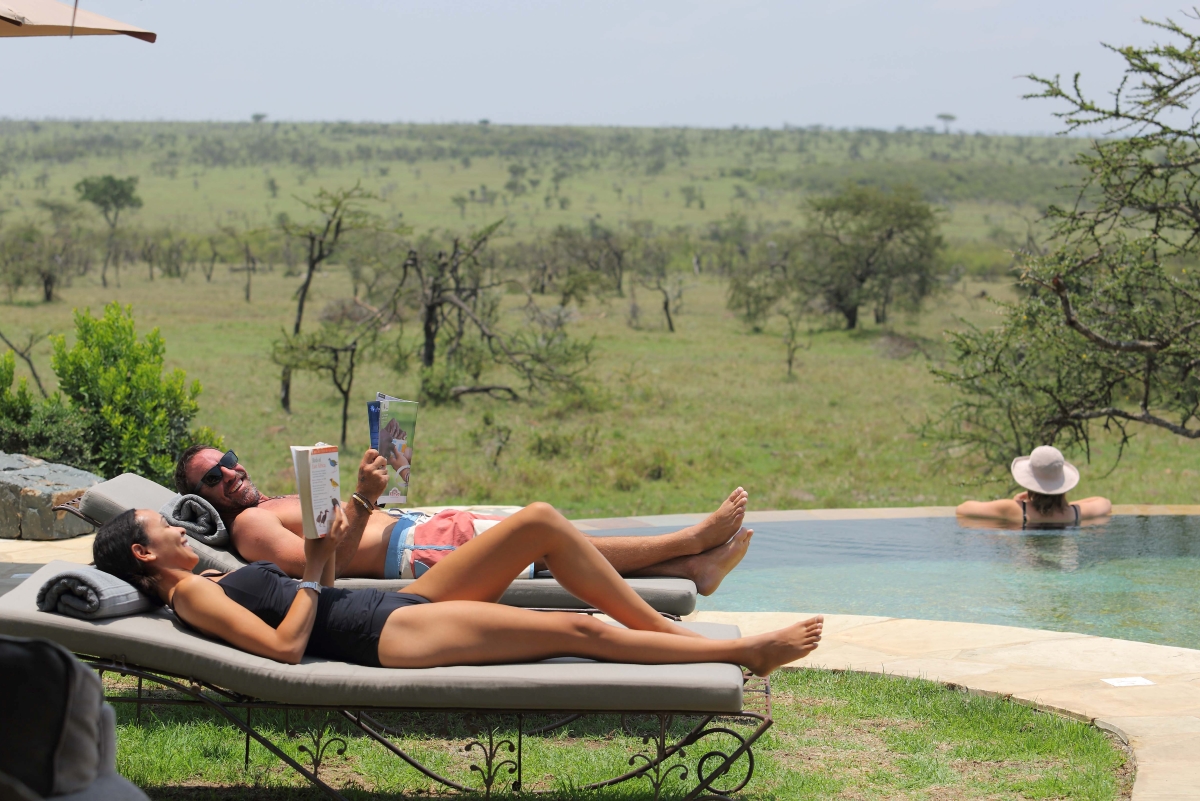 Guests relaxing by the camp's main pool