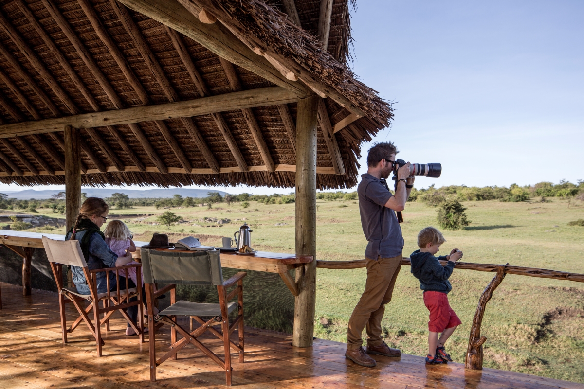 Family observing wildlife from viewing deck