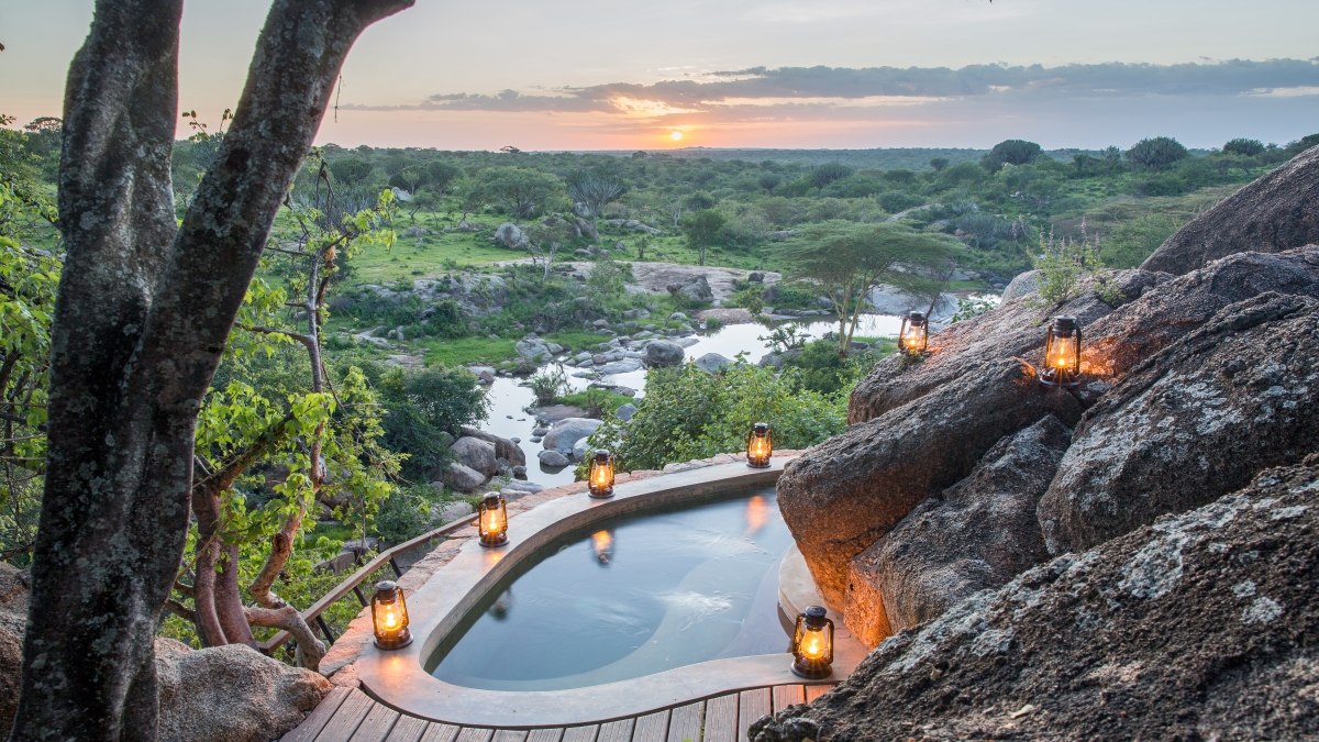 expansive pool is set on a rocky outcrop overlooking natural springs