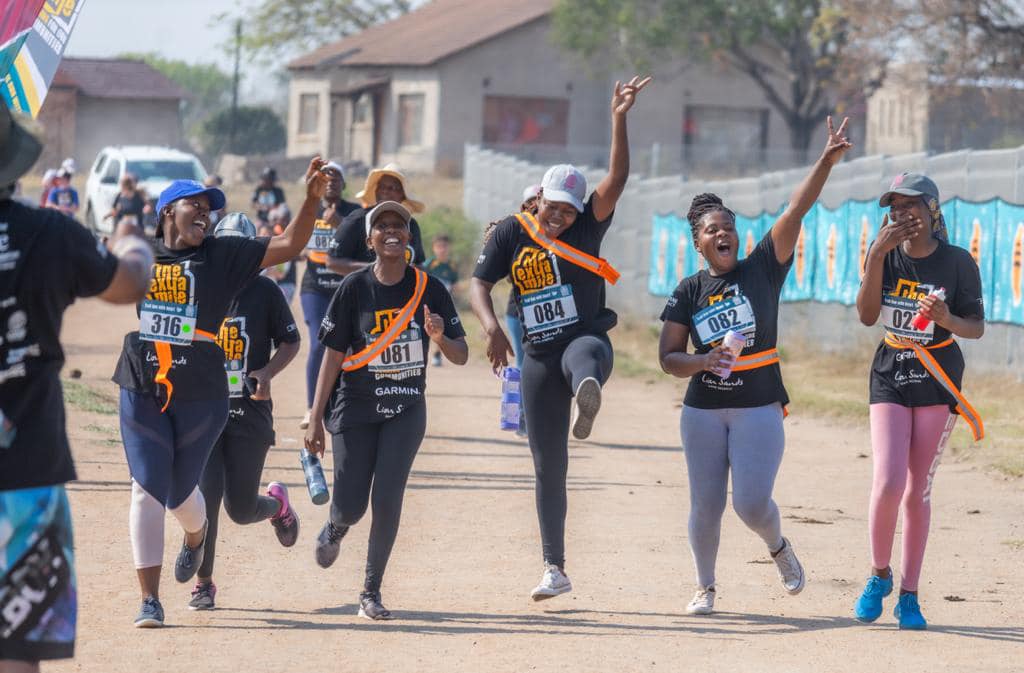 Participants from the community approaching the finish line