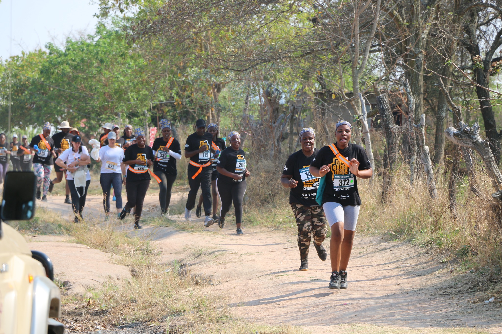 Runners running the Extra Mile Trail Run