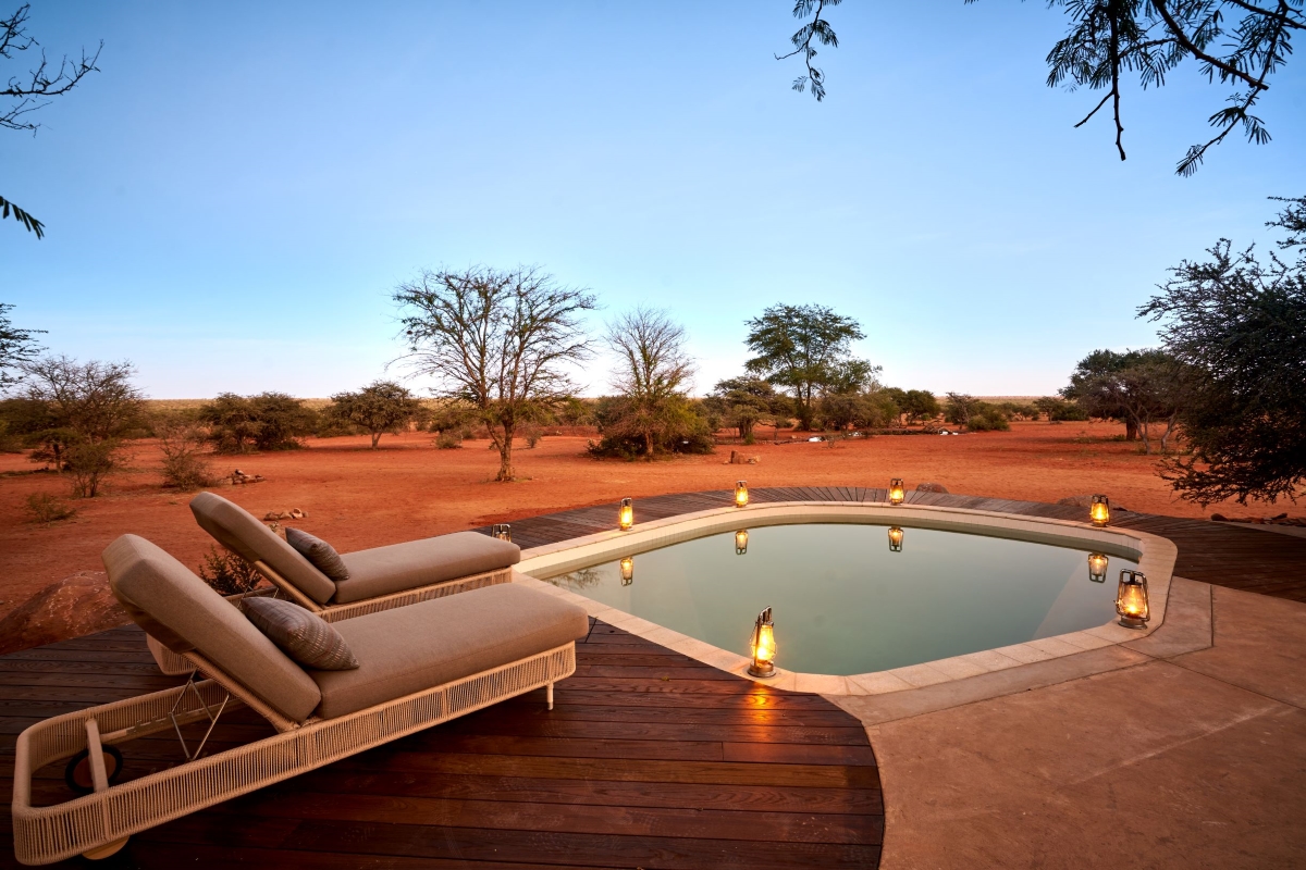 Private deck with sun loungers and pool