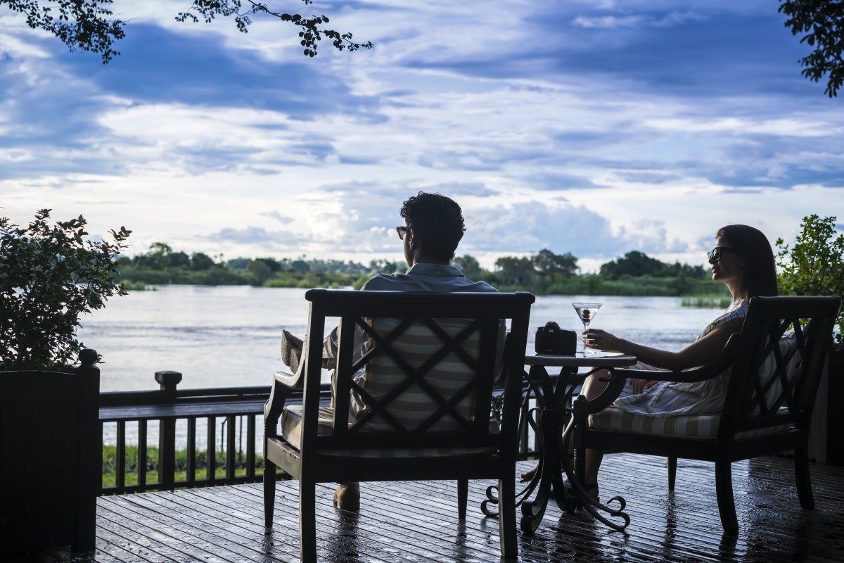 Couple enjoying the views of the Zambezi River from the hotel's sun deck