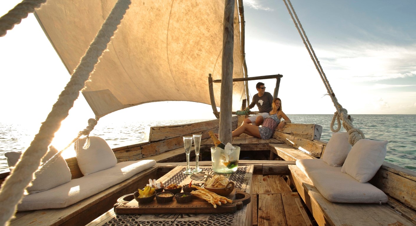 Couple enjoying a sailing excursion in a traditional dhow