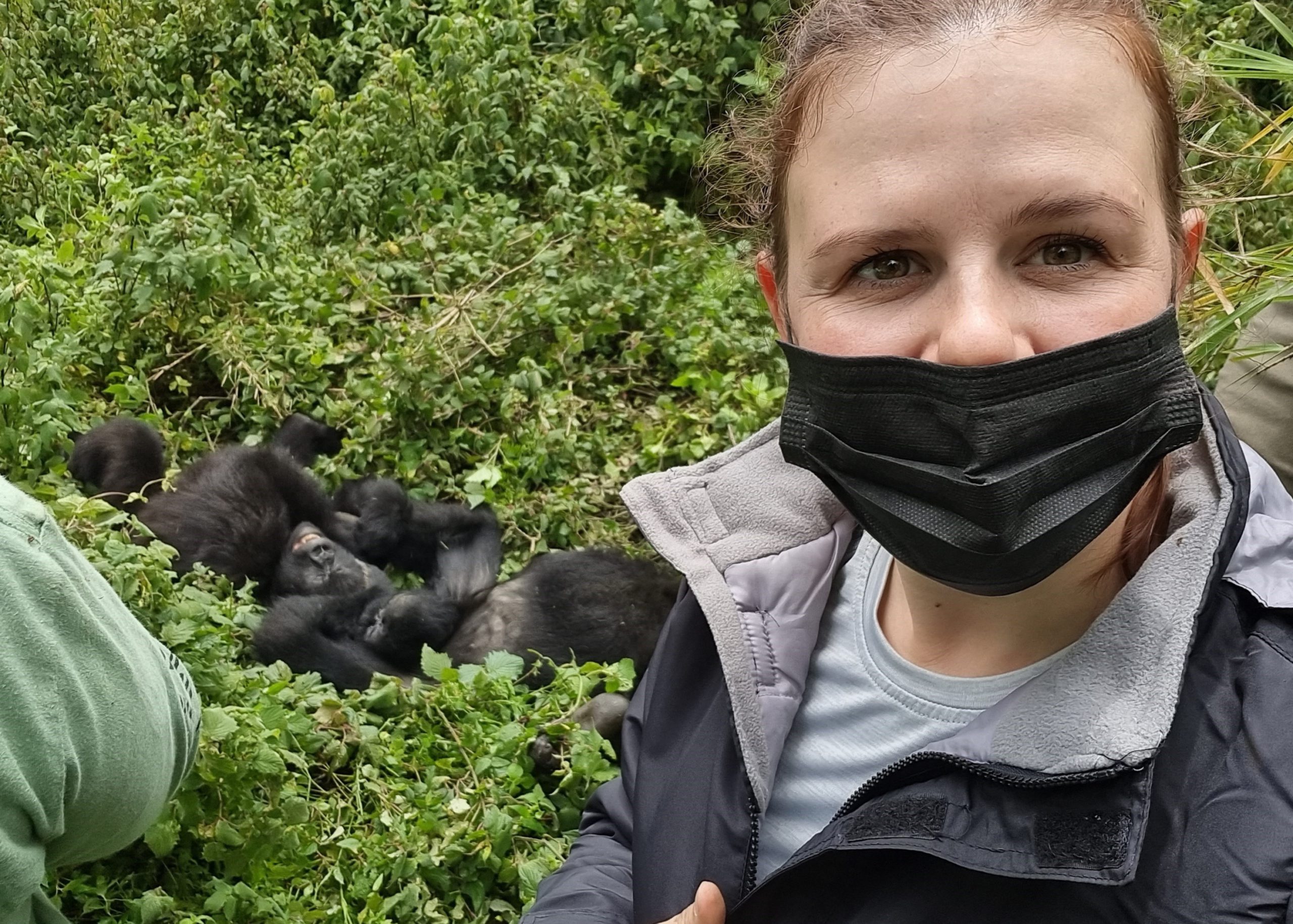 Allison in front of two gorilla juveniles 