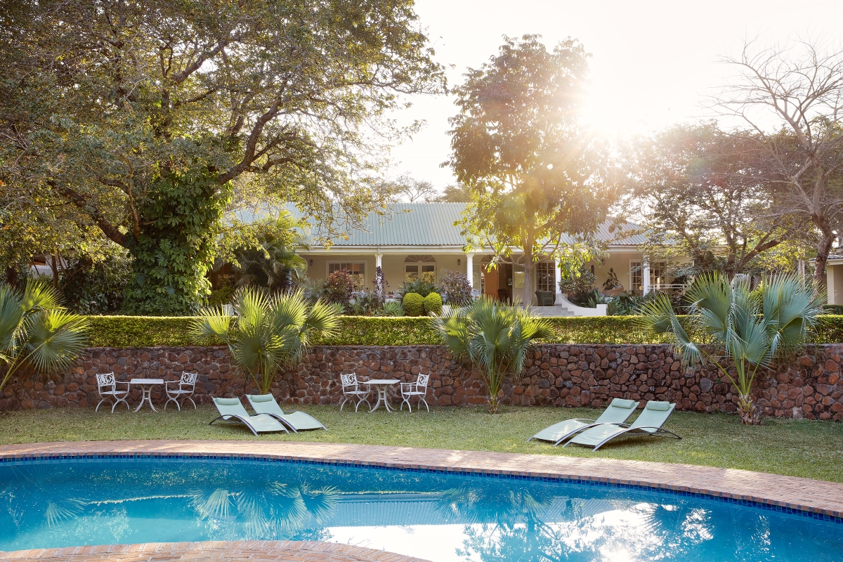 Batonka Guest Lodge pool area with property in the background