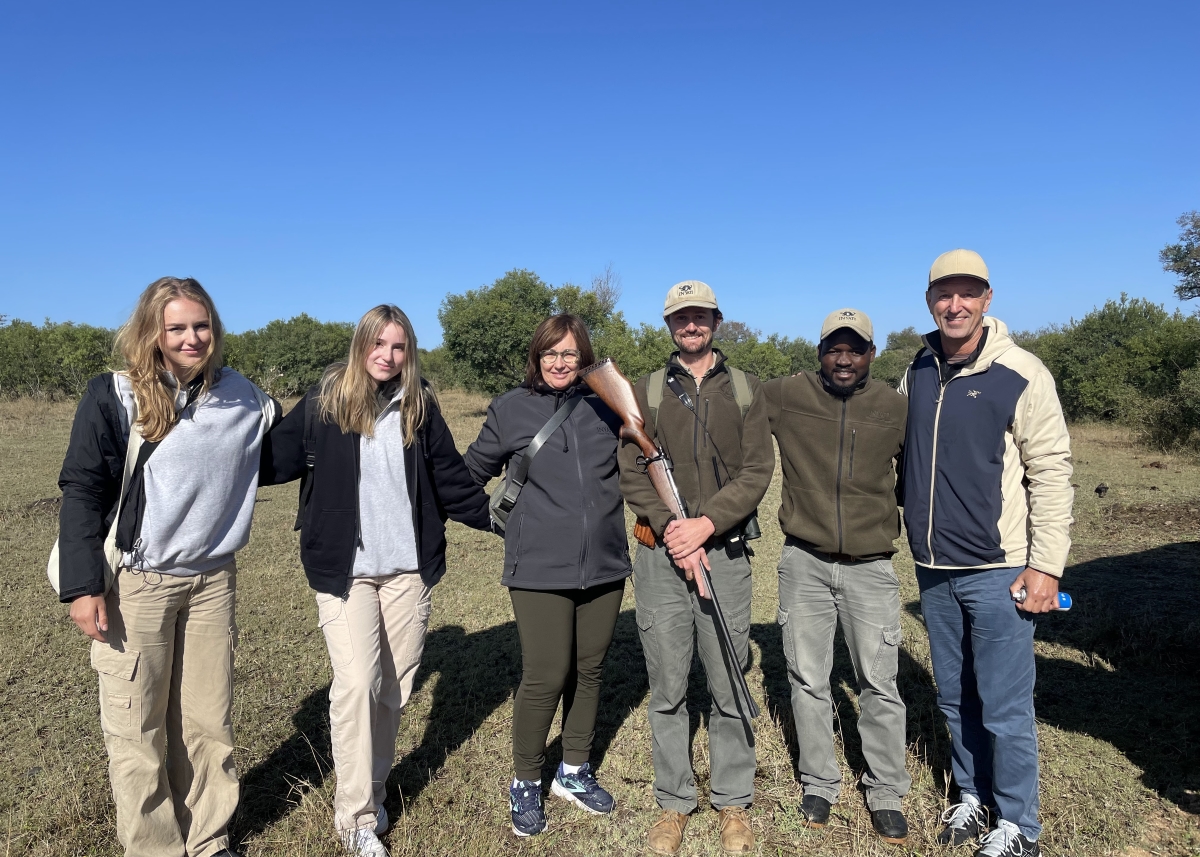 Ken Stamm and family with their ranger and tracker at Inyati